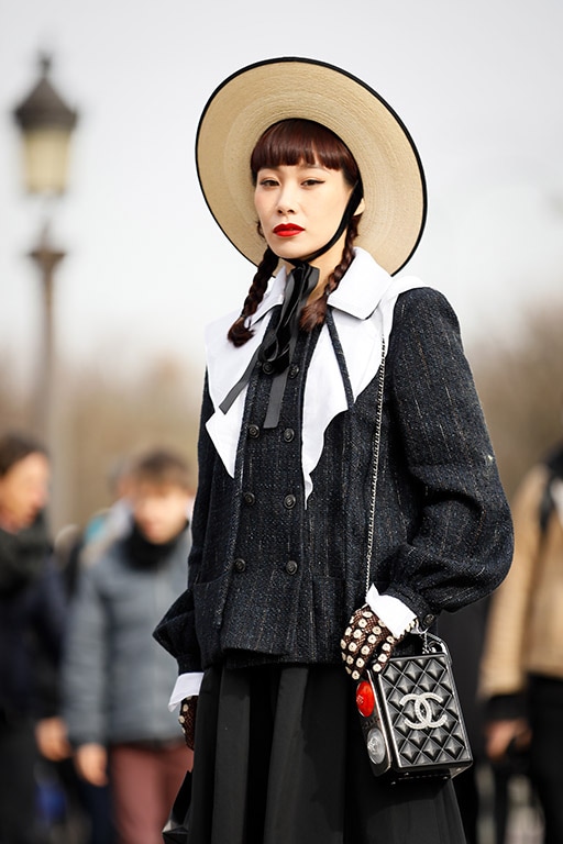 PARIS, FRANCE - MARCH 03: Mademoiselle Yulia wearing Chanel clutch, boater, maxi skirt and a tweed jacket outside Paris Fashion Week Womenswear Fall/Winter 2020/2021 Day Nine on March 03, 2020 in Paris, France. (Photo by Hanna Lassen/Getty Images)