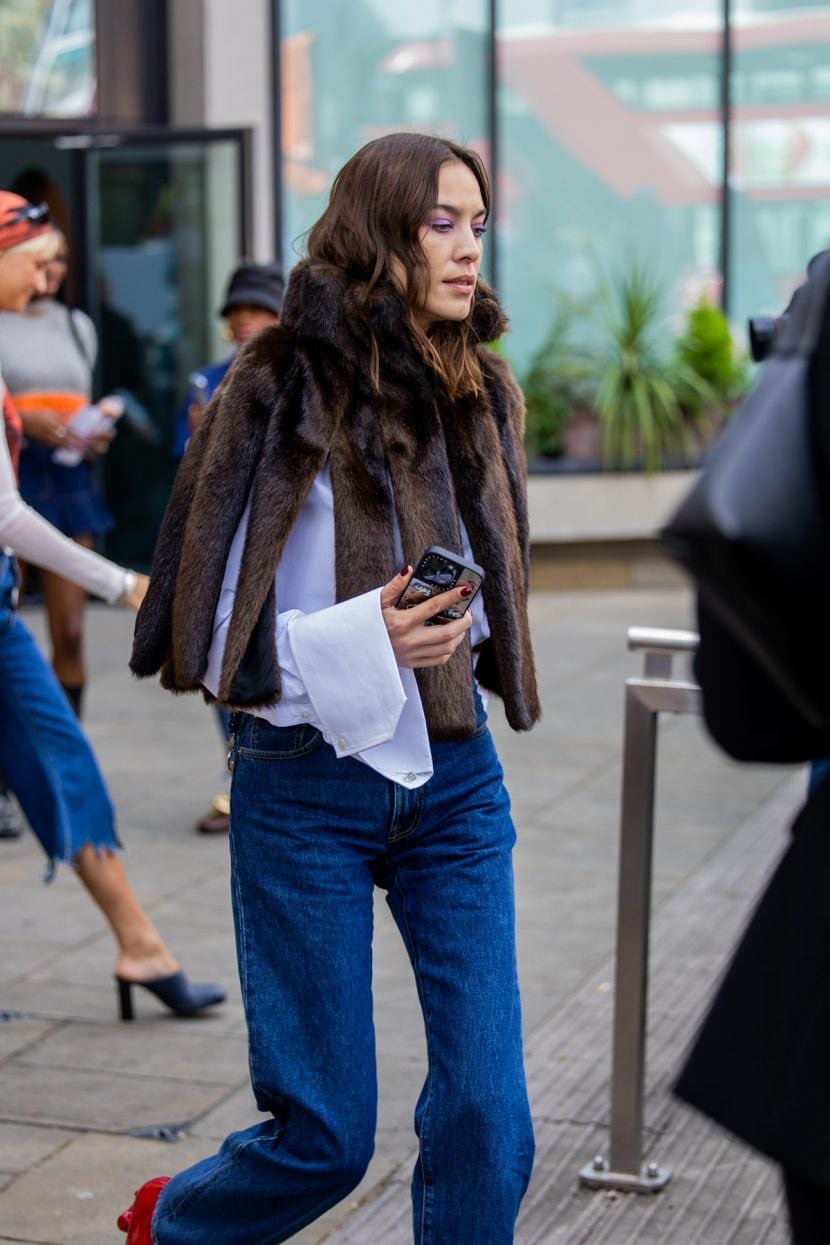 Alexa Chung con fur cape + jeans + red shoes 